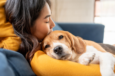 woman hugging a dog